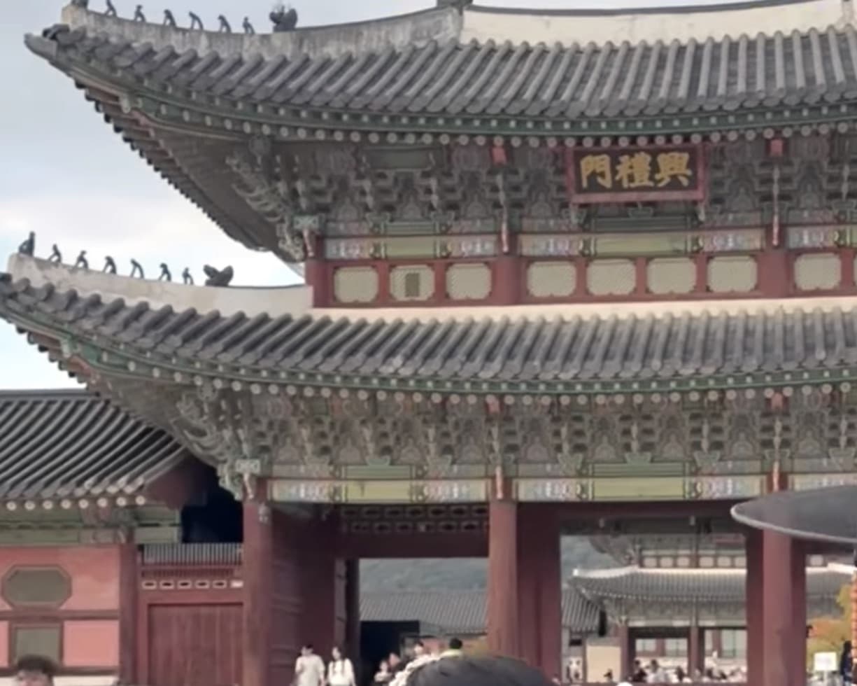 Heungnyemun gate at Gyeongbokgung Palace on a clear afternoon.
